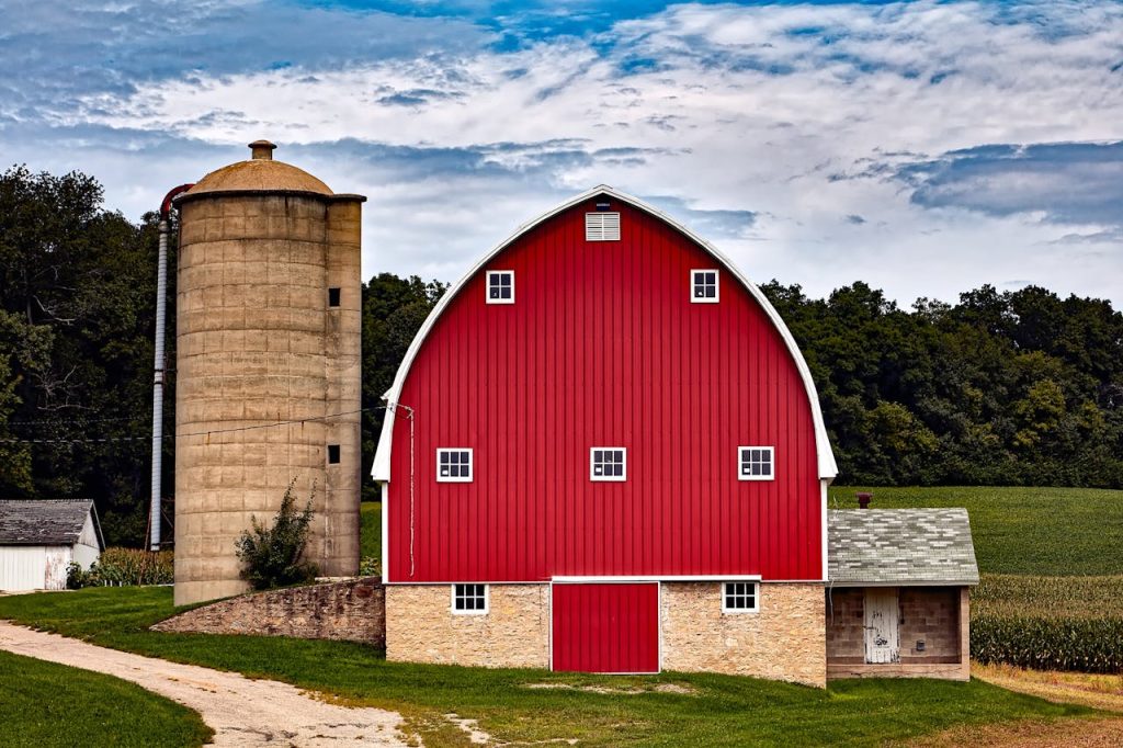 Picturesque red barn with silo in Cross Plains, WI, showcasing rural charm.